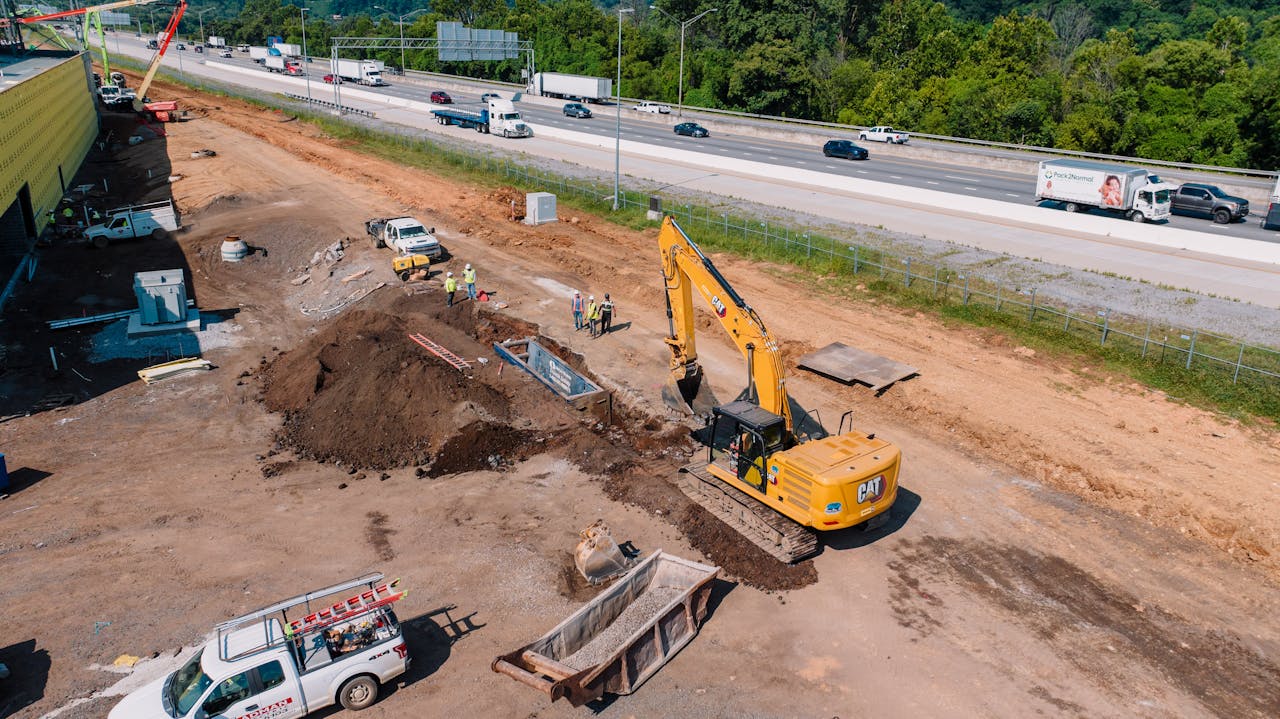 about-01 An aerial view capturing heavy machinery at a Chattanooga construction site.
